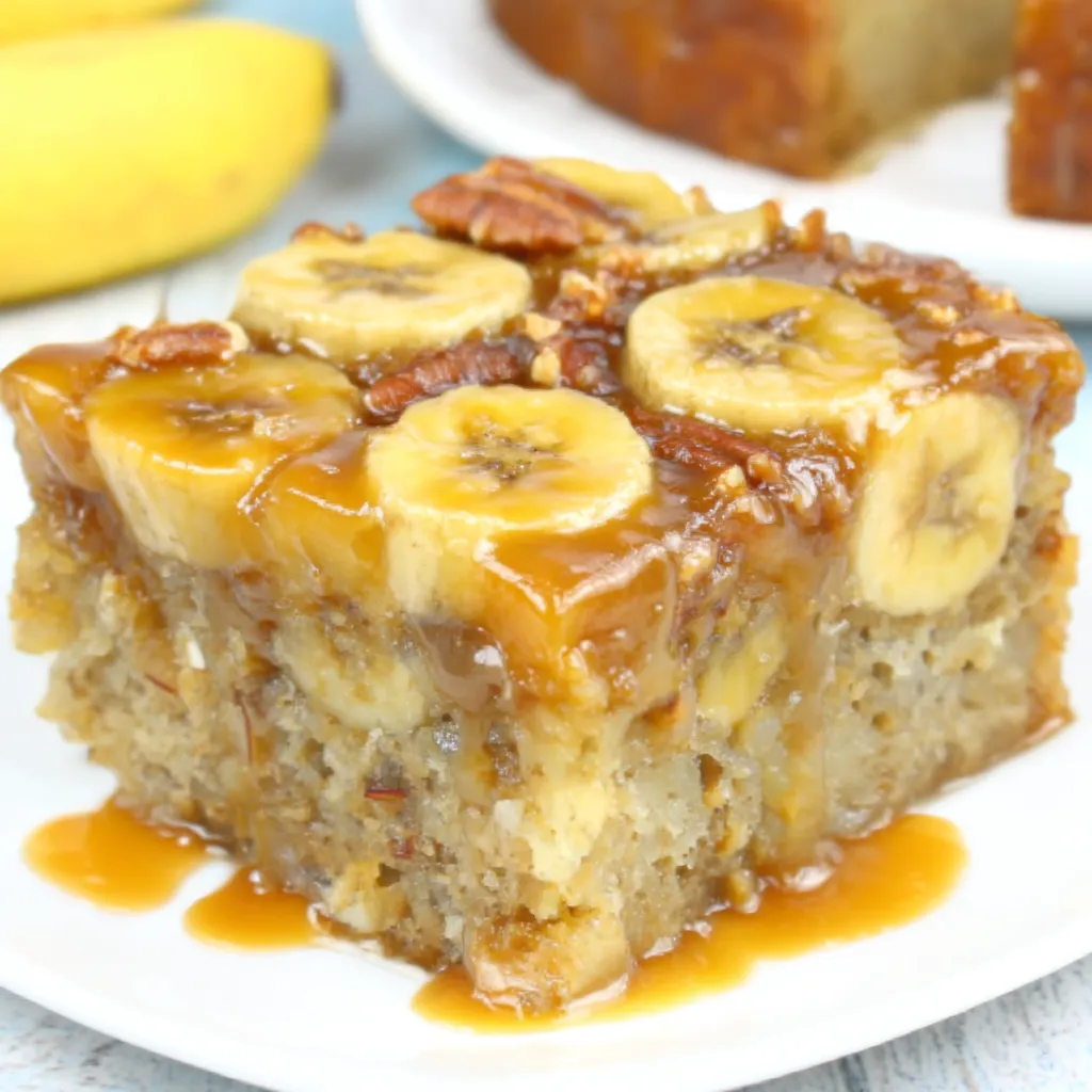 A slice of banana bread with caramel drizzle.