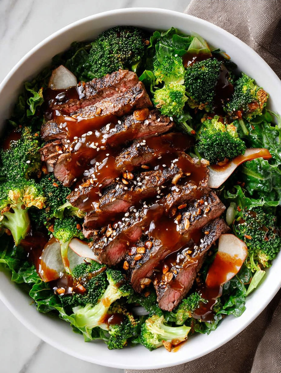 A bowl of food with meat and broccoli.