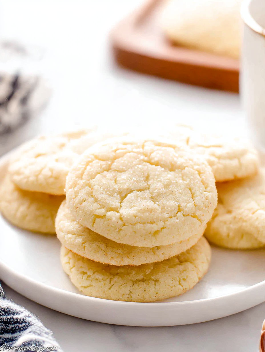 A plate of cookies with a cup of coffee.