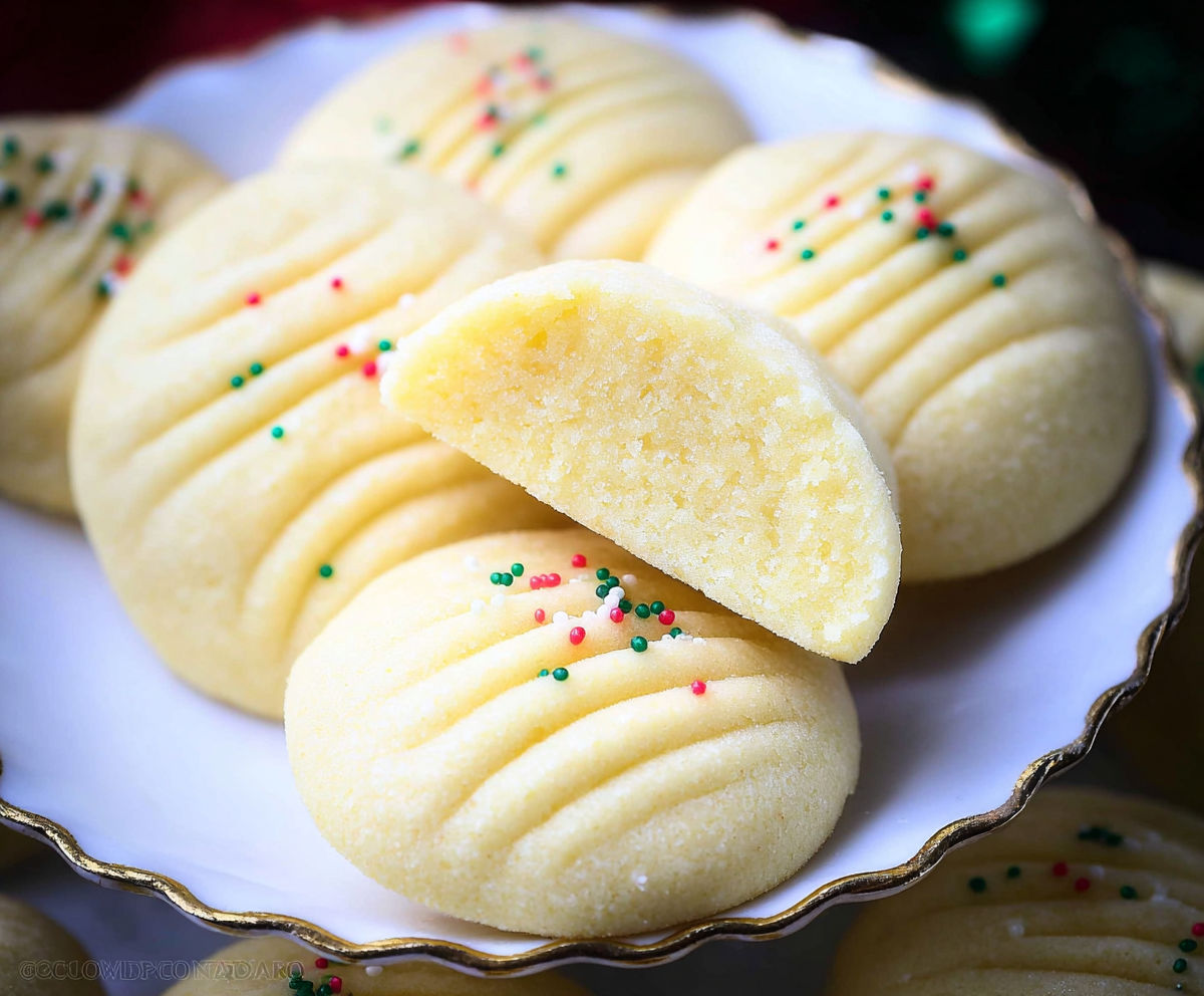A plate of cookies with sprinkles.