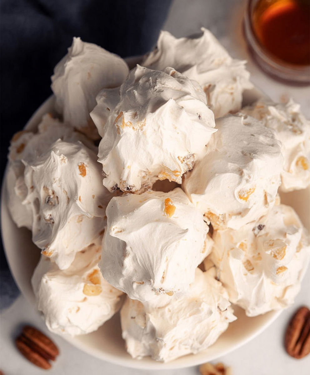 A plate of white cream puffs.