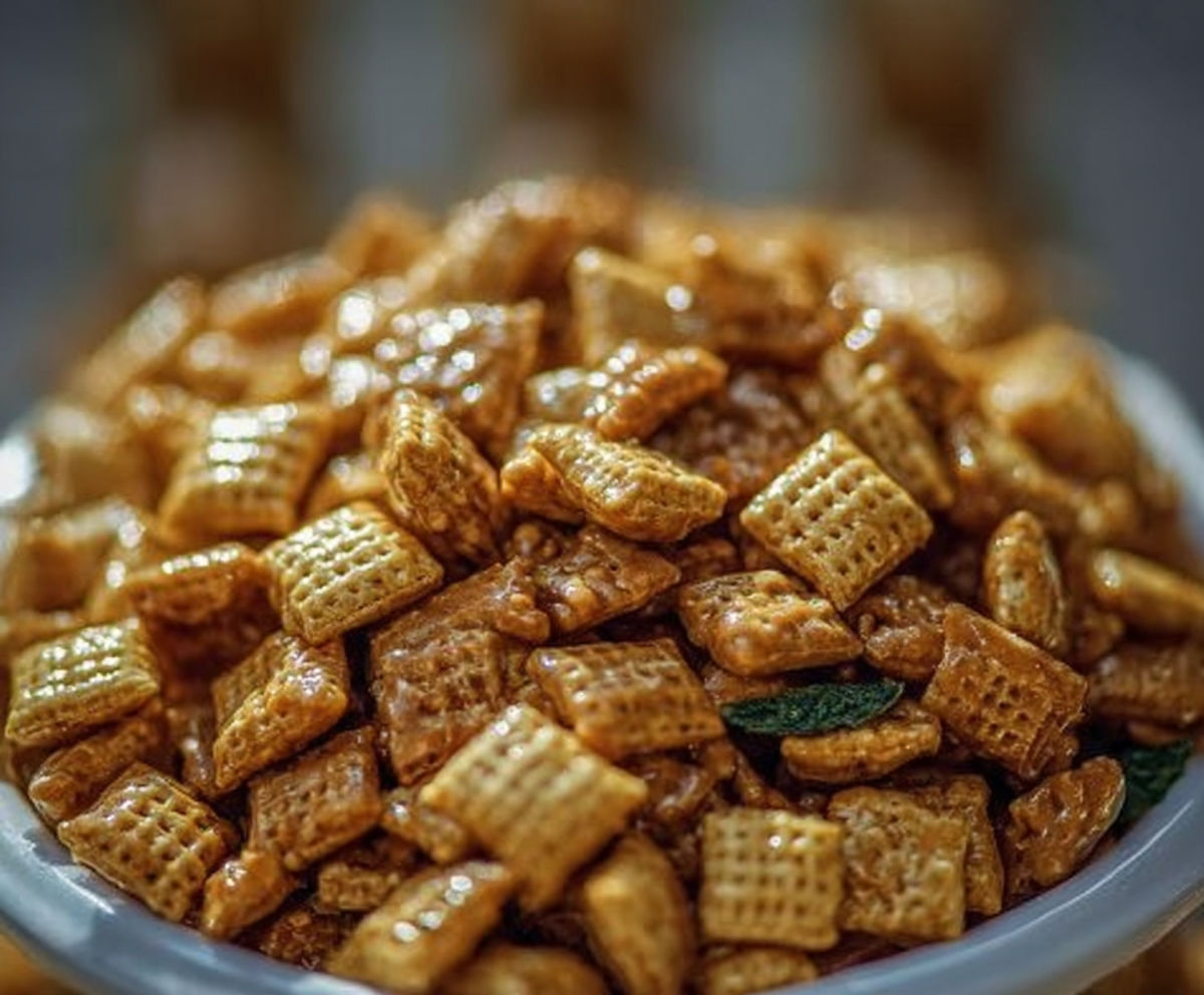 A bowl of cereal with a green leaf on top.