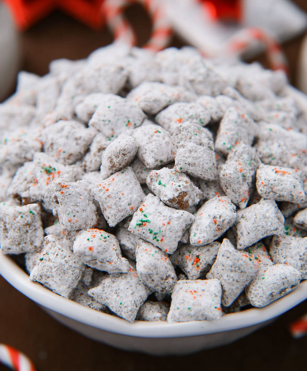 A bowl of candy with a green and orange star on top.