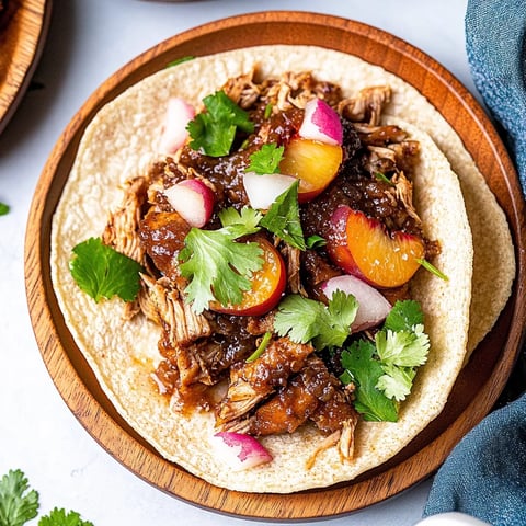 A plate of food with a taco and meat.