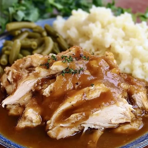 A plate of food with chicken and potatoes.