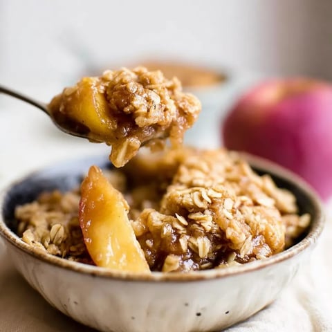 A bowl of cereal with a spoon in it.