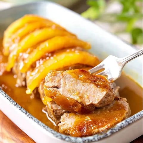 A fork is in a bowl of meat and sauce.