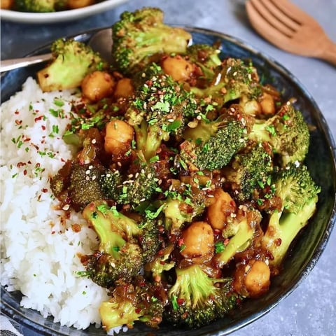 A bowl of rice and broccoli.