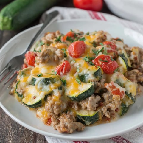 A plate of food with a fork on it.
