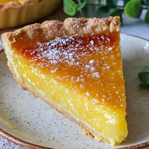 A slice of pie with a yellow filling.