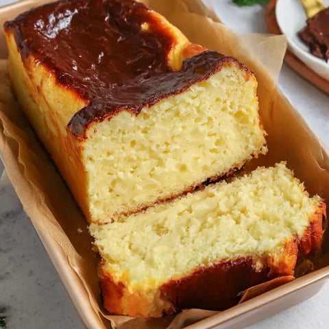 A slice of cake with chocolate frosting.