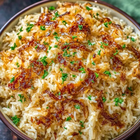A bowl of rice with green onions.
