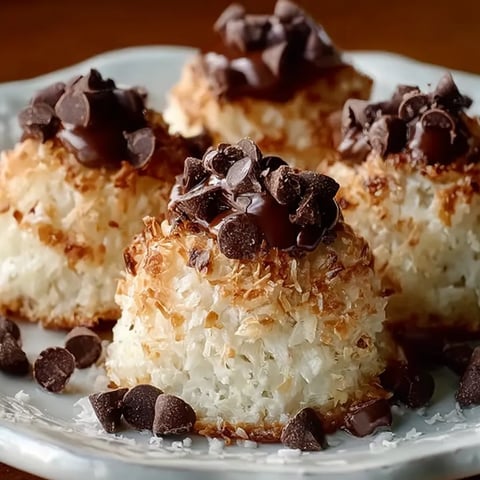 A plate of food with chocolate drizzled on top.
