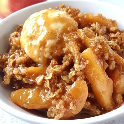 A bowl of food with a scoop of ice cream on top.