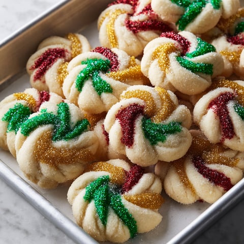 A pan of cookies with sprinkles.