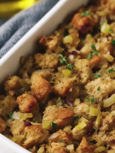 A white bowl filled with a casserole dish.