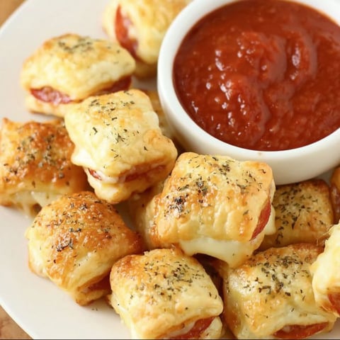 A plate of food with a bowl of sauce.