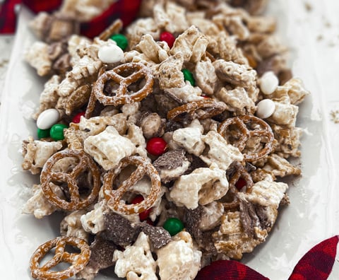 A plate of cereal with marshmallows and candy canes.