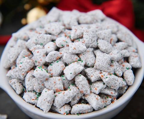 A bowl of white and orange marshmallows.