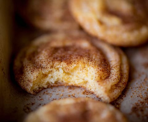 A batch of cookies with cinnamon and sugar.