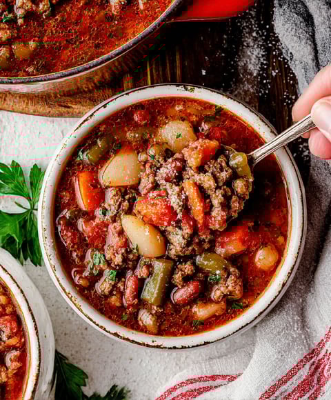A bowl of beans and vegetables.