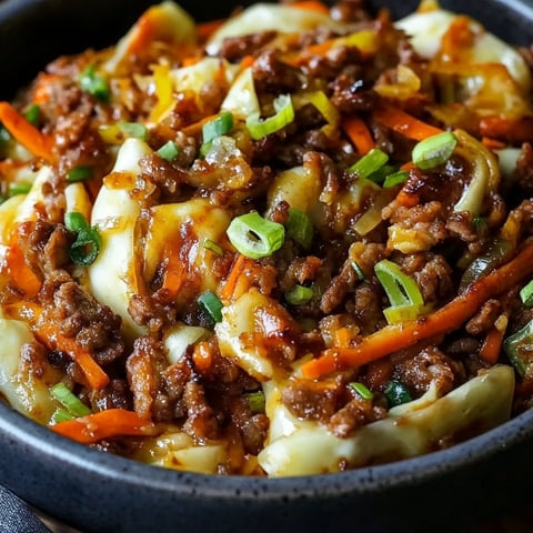 A bowl of beef and vegetables.